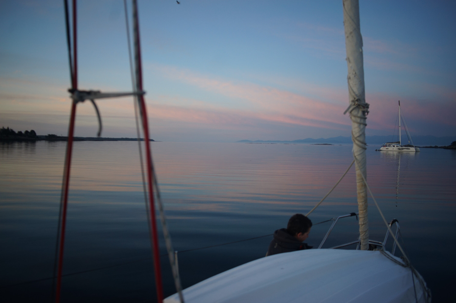 Rek at the bow, sunless skies.