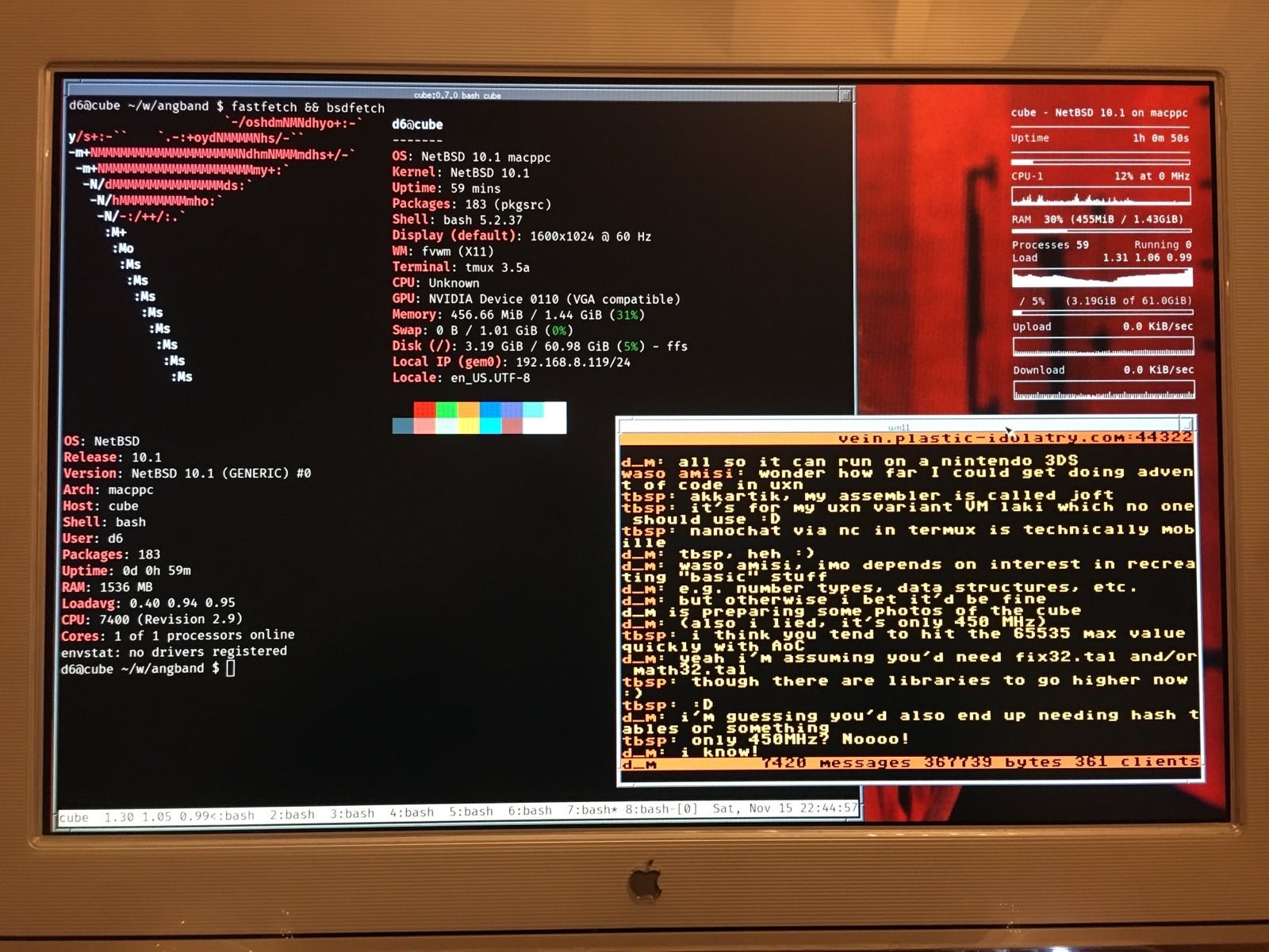 Close up of the display. It's showing a system monitor, an xterm with some system information, and a nanochat window.