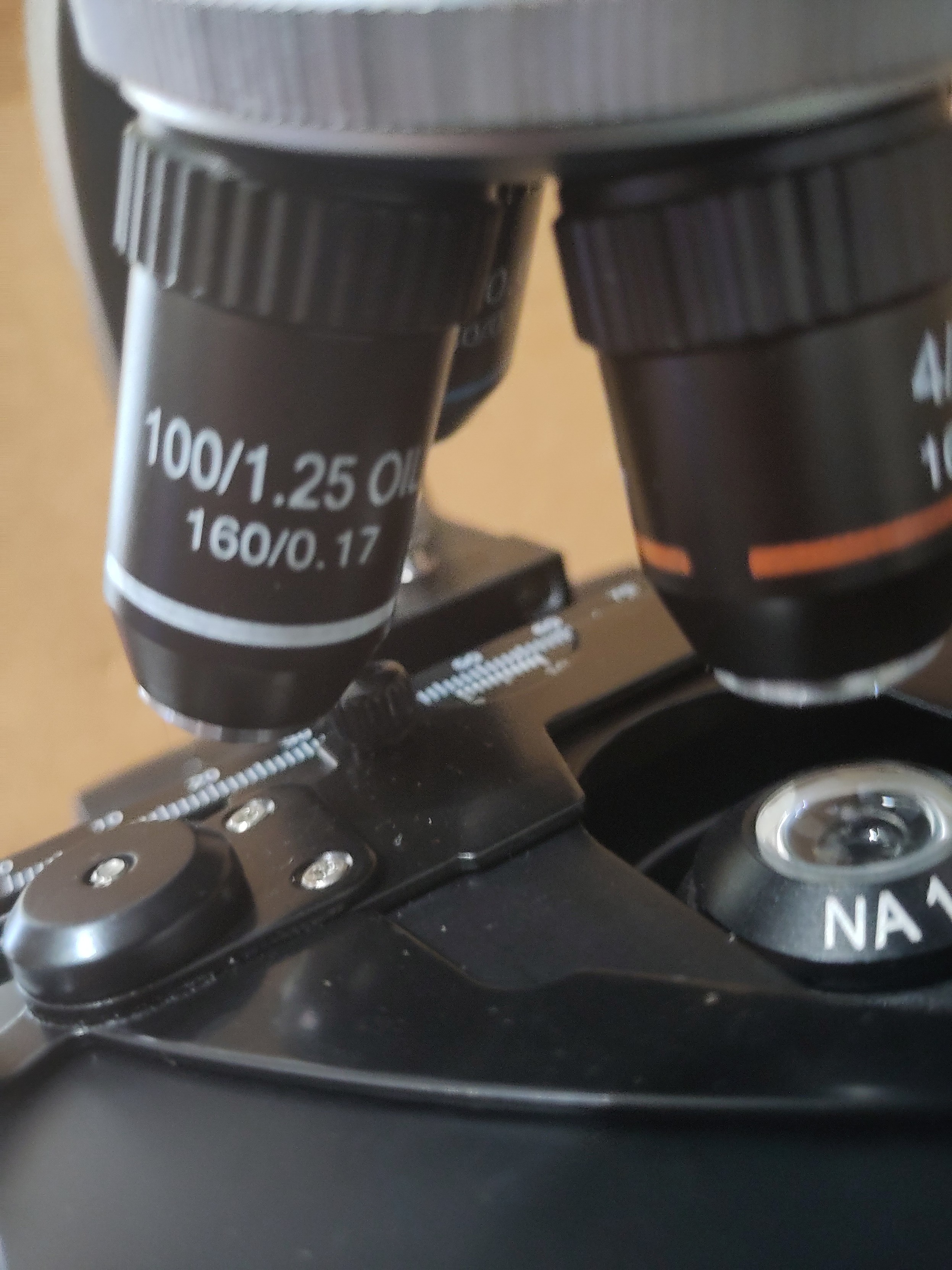 Close-up shot of the objective lenses of the microscope